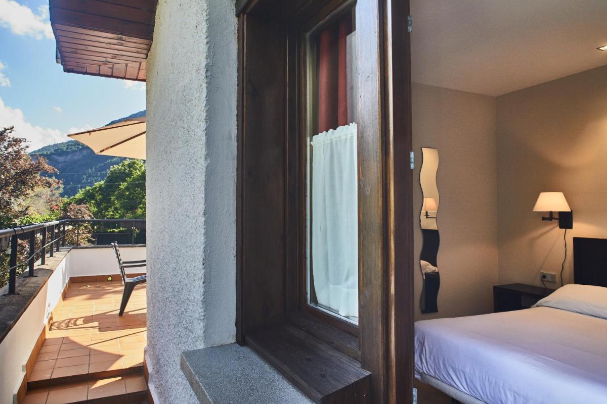 Cama o camas de una habitación en Silken Ordesa