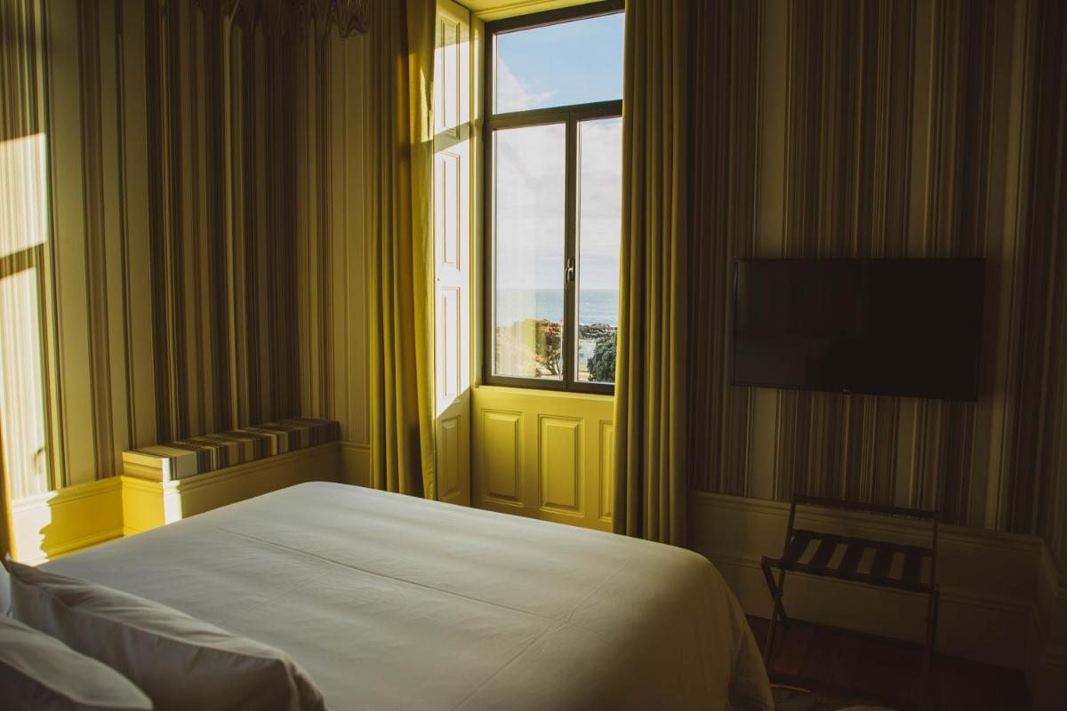 Uma cama ou camas num quarto em Vila Foz Hotel & SPA - member of Design Hotels