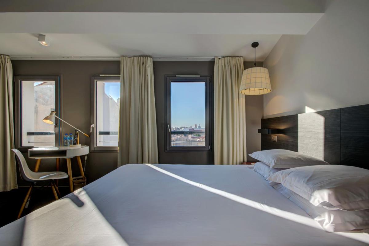 Un ou plusieurs lits dans un hébergement de l'établissement Alex Hotel & Spa