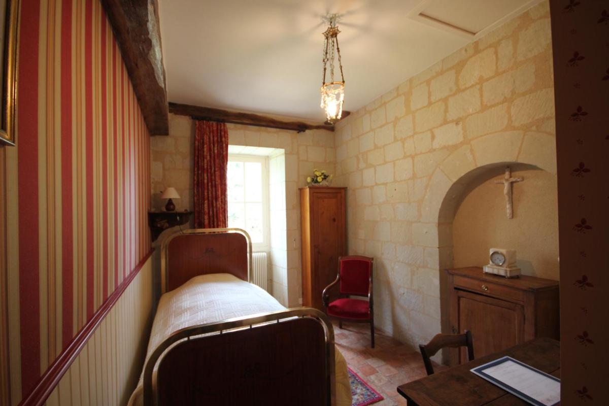 Un ou plusieurs lits dans un hébergement de l'établissement Le Domaine de Mestré, The Originals Relais