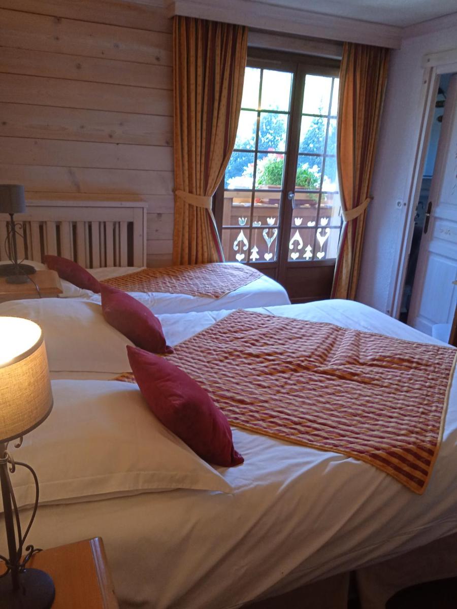 Un ou plusieurs lits dans un hébergement de l'établissement Hotel les Sapins