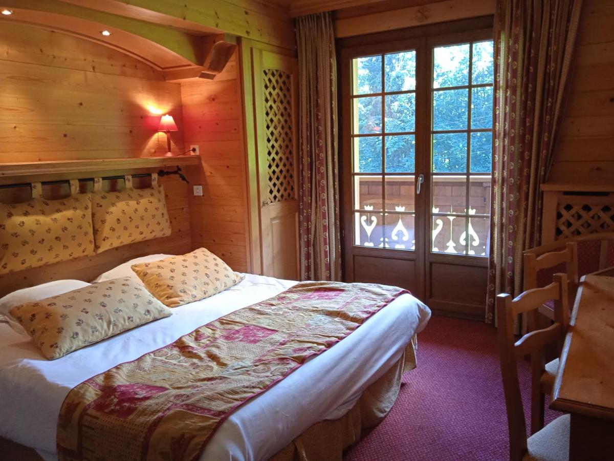 Un ou plusieurs lits dans un hébergement de l'établissement Hotel les Sapins