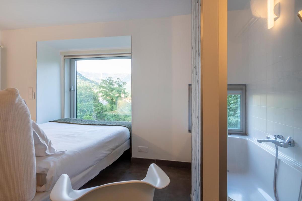 Un ou plusieurs lits dans un hébergement de l'établissement Artemisia Boutique Hotel