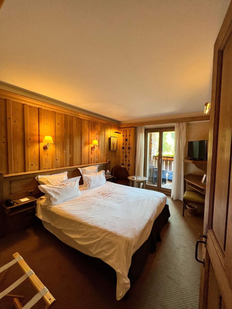 Un ou plusieurs lits dans un hébergement de l'établissement Hôtel-Restaurant Les Bas-Rupts, Singuliers Hôtel