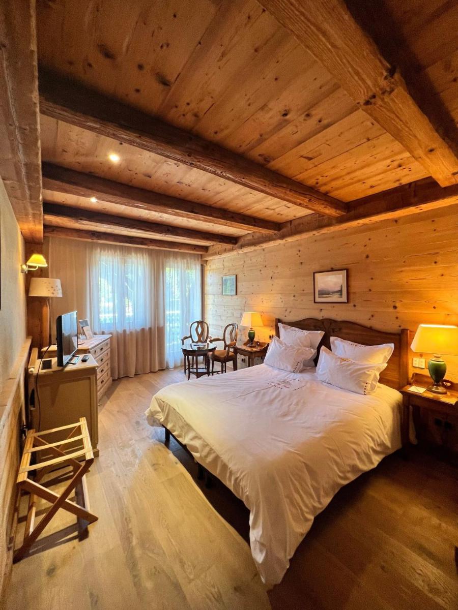 Un ou plusieurs lits dans un hébergement de l'établissement Hôtel-Restaurant Les Bas-Rupts, Singuliers Hôtel