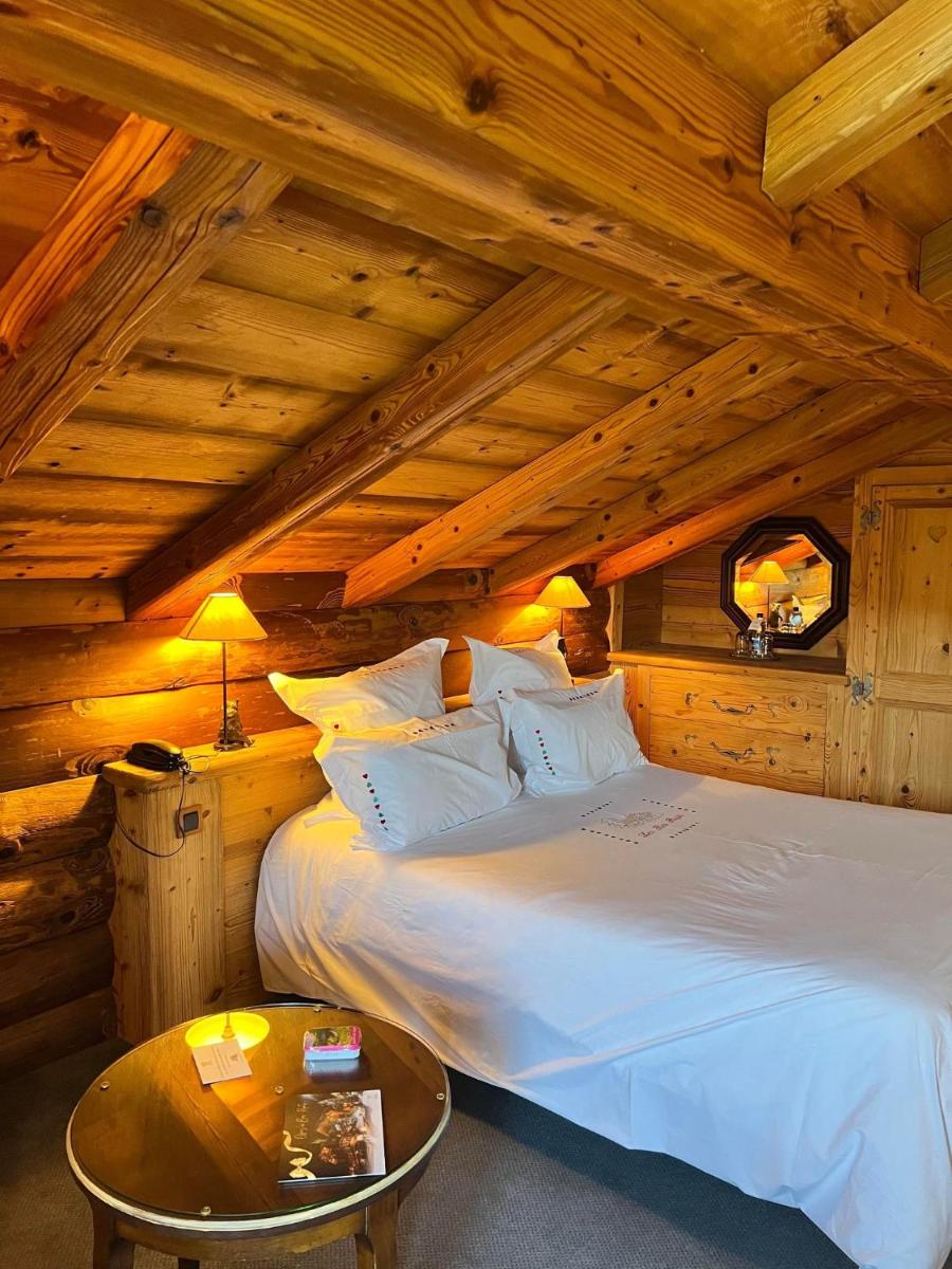 Un ou plusieurs lits dans un hébergement de l'établissement Hôtel-Restaurant Les Bas-Rupts, Singuliers Hôtel