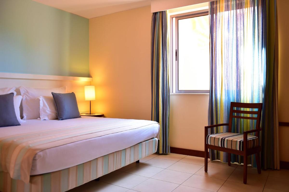 Uma cama ou camas num quarto em Pestana Porto Santo Premium All Inclusive Beach & SPA Resort