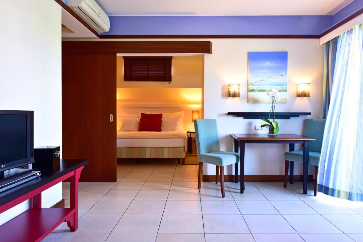 Uma televisão e/ou sistema de entretenimento em Pestana Porto Santo Premium All Inclusive Beach & SPA Resort