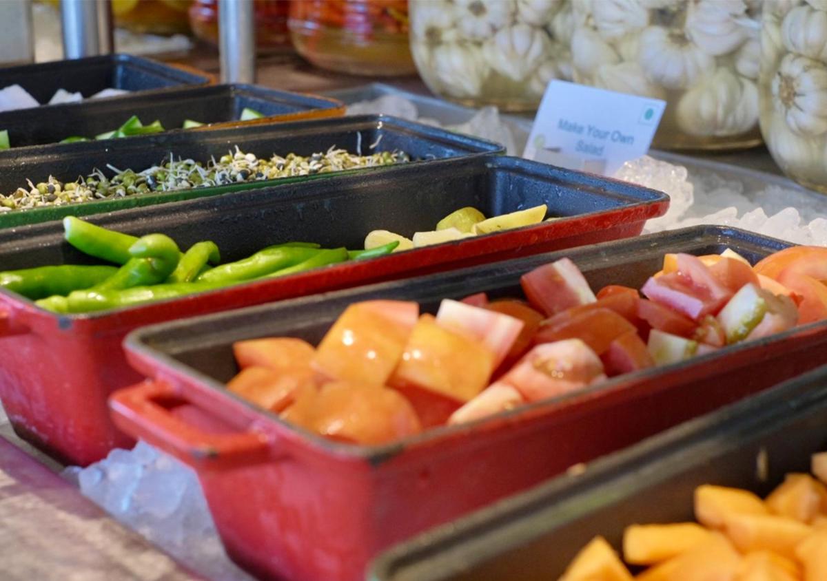 three trays of fruits and vegetables on a table at Holiday Inn Chennai OMR IT Expressway by IHG in Chennai