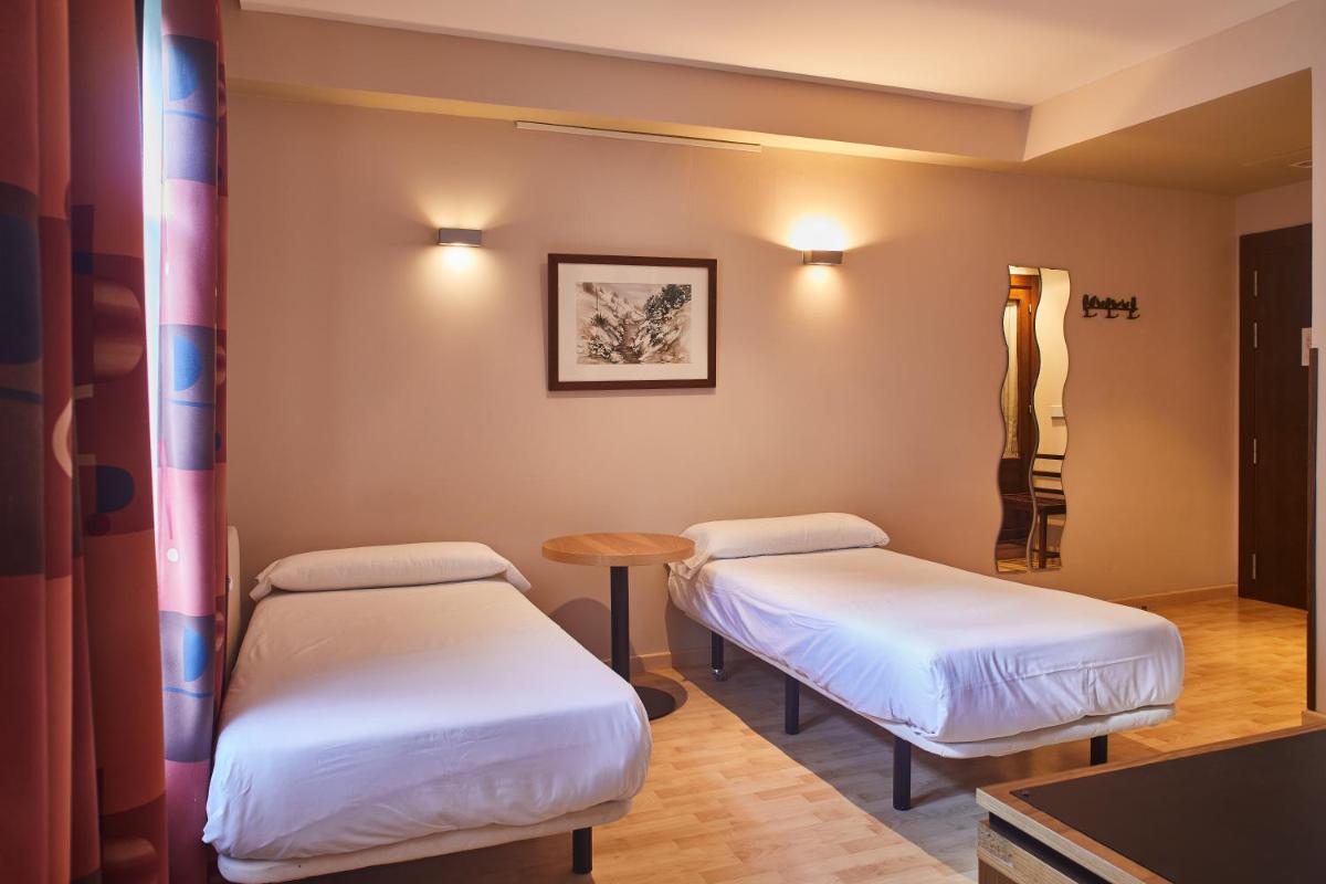 Cama o camas de una habitación en Silken Ordesa