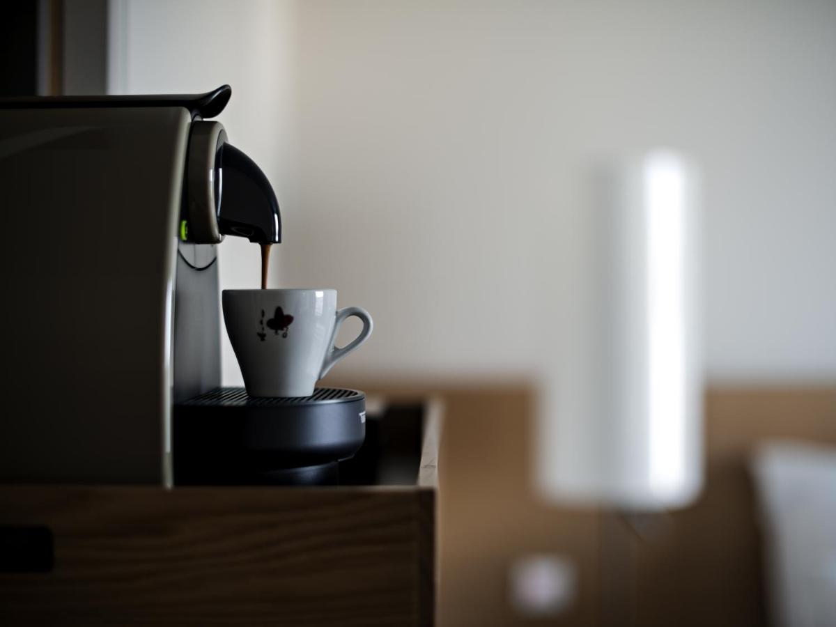 a coffee cup sitting on top of a table at Novotel Kolkata Hotel and Residences in Kolkata a coffee cup sitting on top of a table at Novotel Kolkata Hotel and Residences in Kolkata
