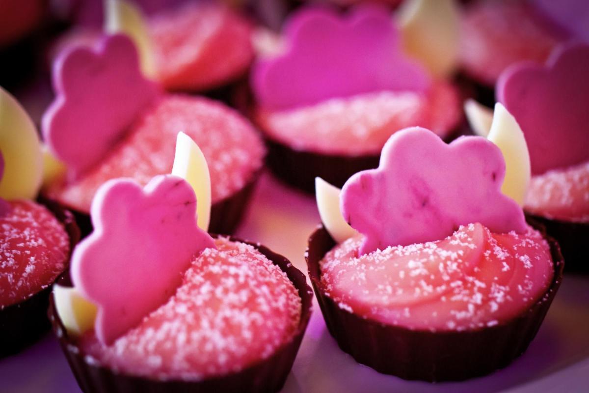 a group of pink cupcakes with hearts on them at Novotel Kolkata Hotel and Residences in Kolkata a group of pink cupcakes with hearts on them at Novotel Kolkata Hotel and Residences in Kolkata