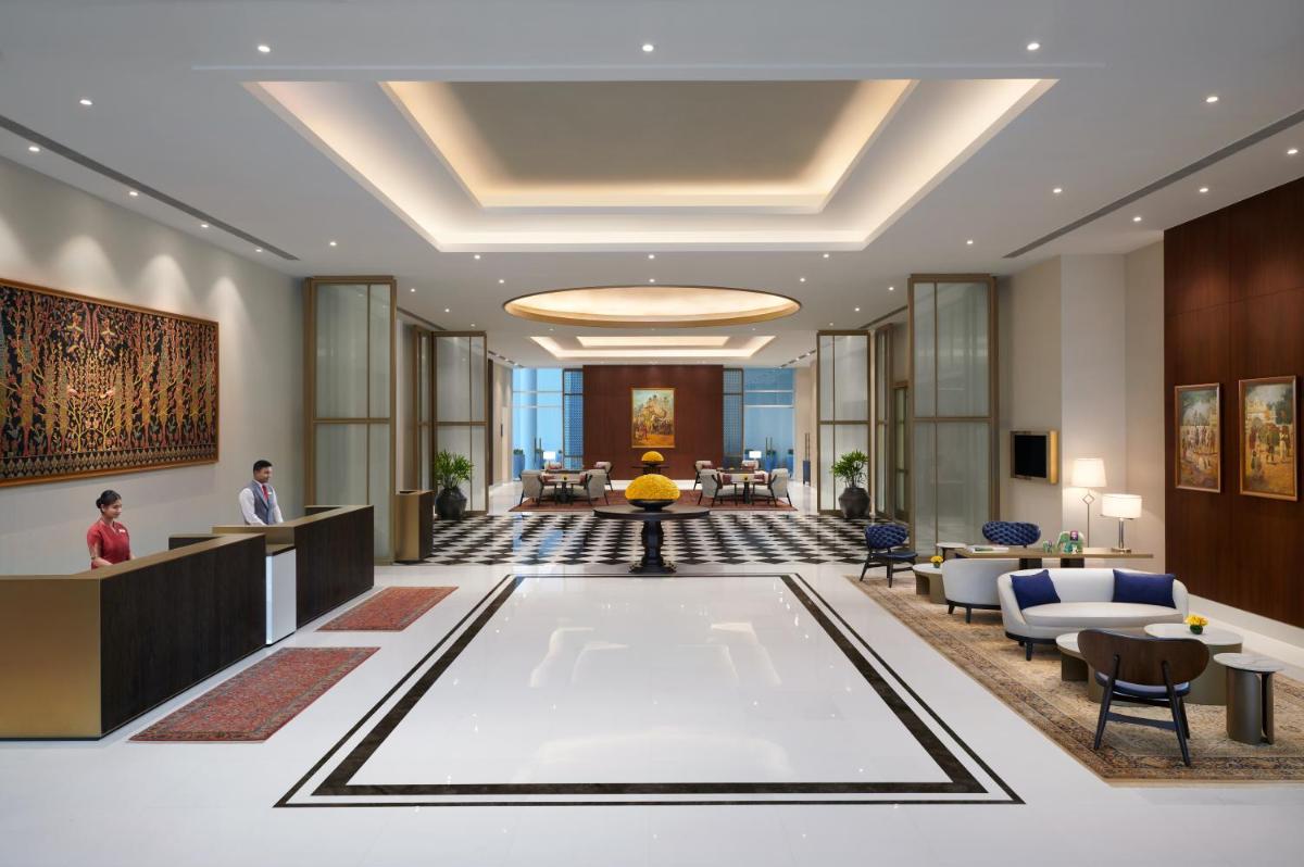 a rendering of the lobby of a hotel at The Leela Bhartiya City Bengaluru in Bengaluru +80 photos a rendering of the lobby of a hotel at The Leela Bhartiya City Bengaluru in Bengaluru +80 photos