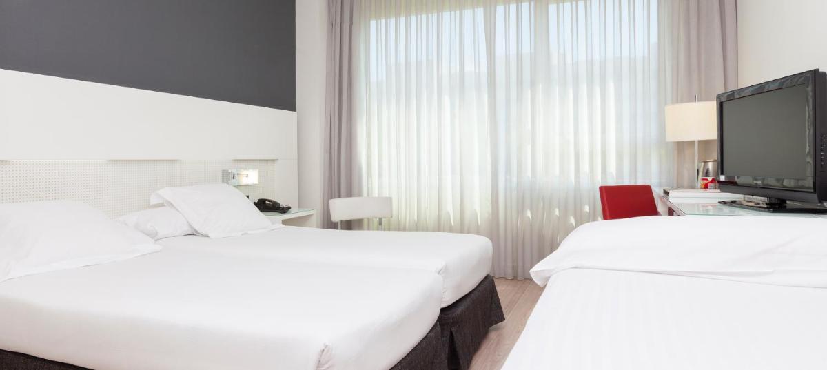 Cama o camas de una habitación en Axor Feria
