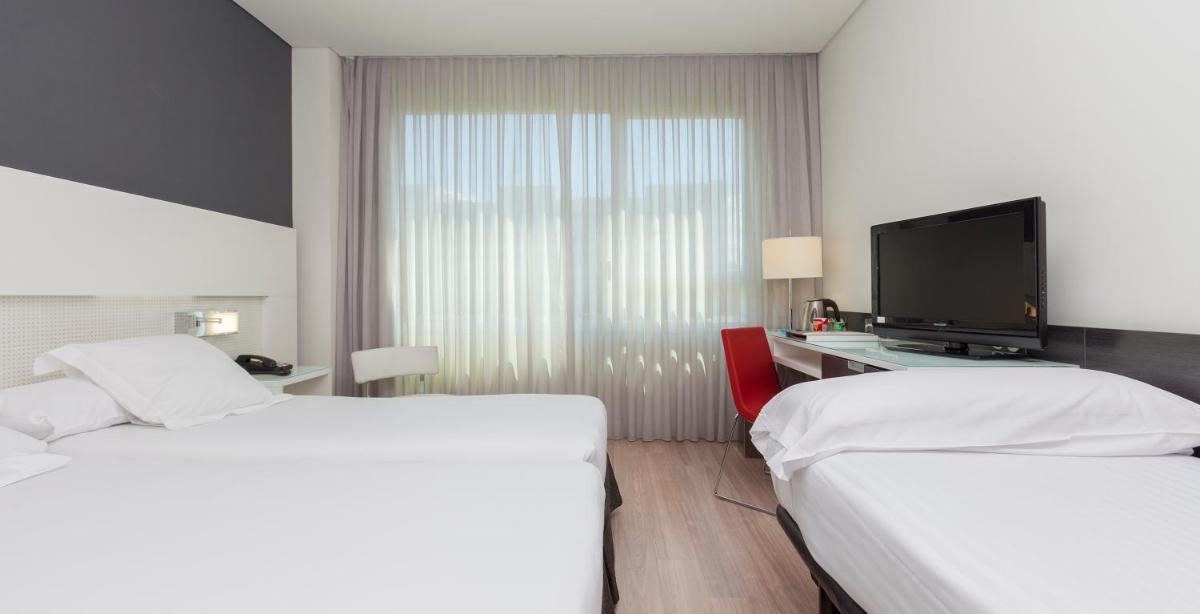 Cama o camas de una habitación en Axor Feria