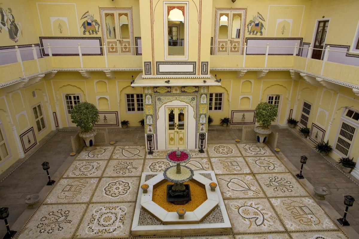 an aerial view of a large building with a fountain at The Raj Palace (Small Luxury Hotels of the World) in Jaipur