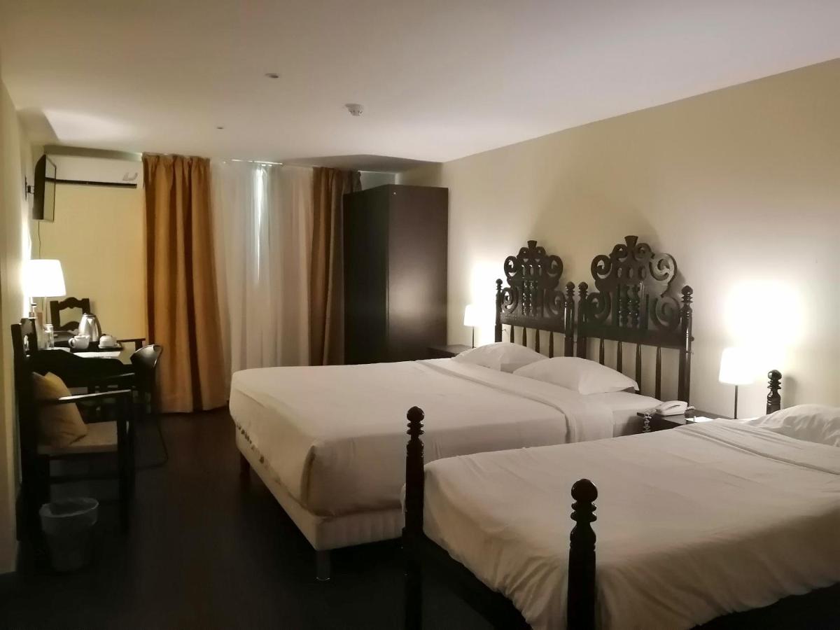 Uma cama ou camas num quarto em Hotel Da Montanha