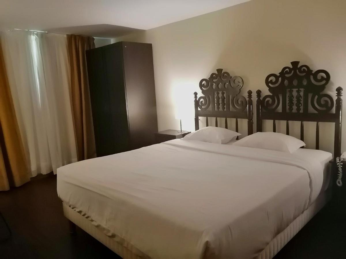 Uma cama ou camas num quarto em Hotel Da Montanha