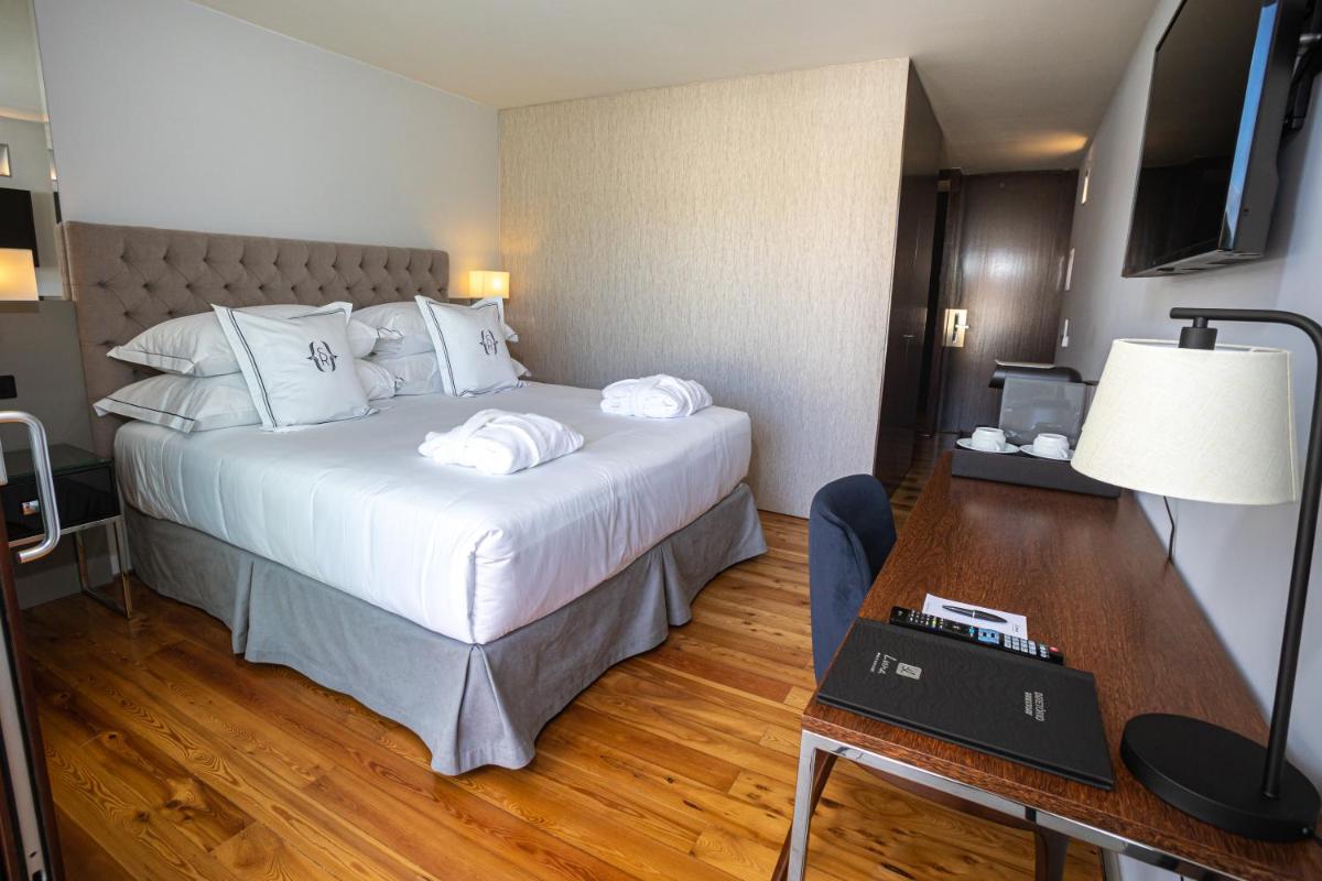 Uma cama ou camas num quarto em Solar do Requeijo by Luna Hotels & Resorts
