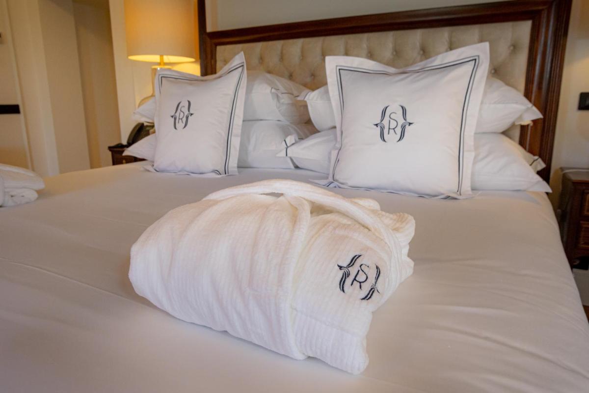 Uma cama ou camas num quarto em Solar do Requeijo by Luna Hotels & Resorts