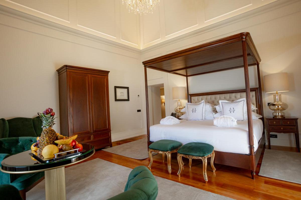 Uma cama ou camas num quarto em Solar do Requeijo by Luna Hotels & Resorts