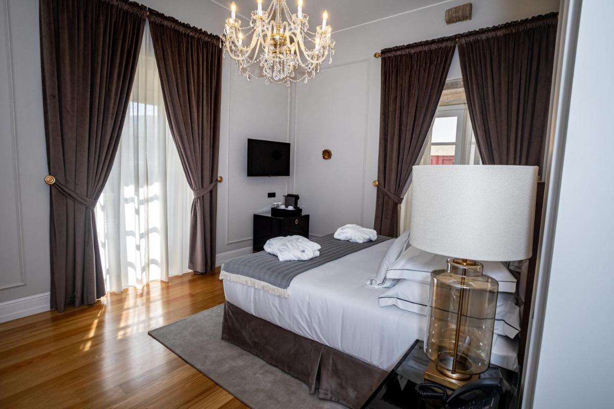 Uma cama ou camas num quarto em Solar do Requeijo by Luna Hotels & Resorts
