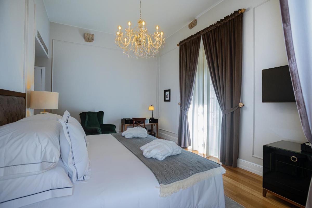 Uma cama ou camas num quarto em Solar do Requeijo by Luna Hotels & Resorts