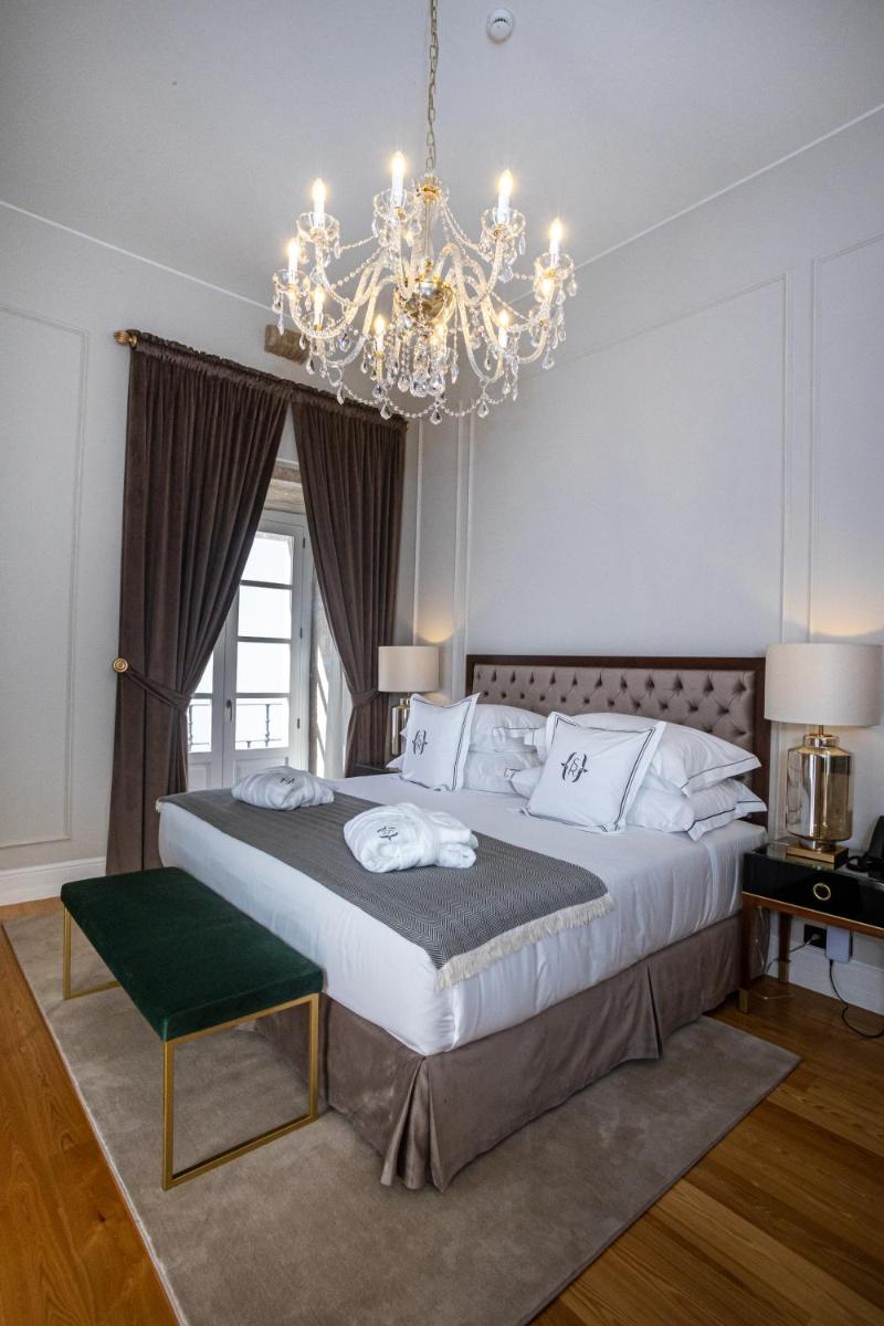 Uma cama ou camas num quarto em Solar do Requeijo by Luna Hotels & Resorts