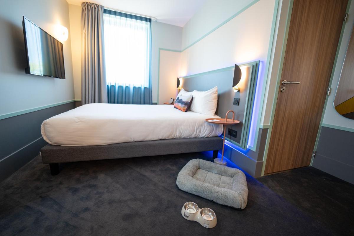 Un ou plusieurs lits dans un hébergement de l'établissement Aiden by Best Western Clermont-Ferrand Hotel & Spa