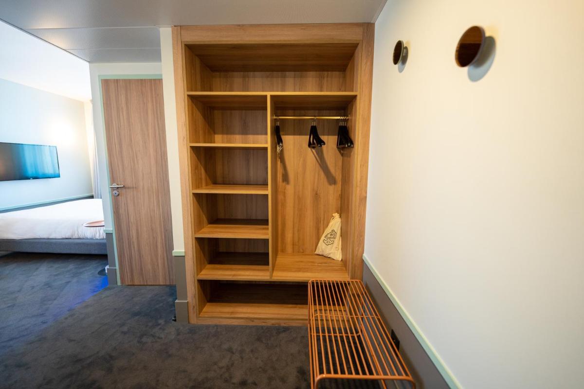 Un ou plusieurs lits dans un hébergement de l'établissement Aiden by Best Western Clermont-Ferrand Hotel & Spa
