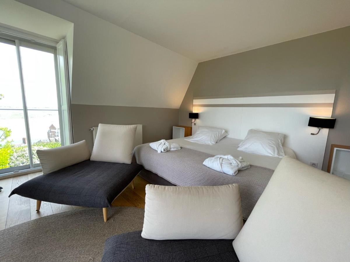 Un ou plusieurs lits dans un hébergement de l'établissement Hôtel - Spa Les Corderies