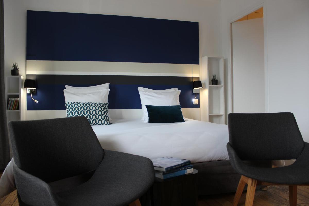 Un ou plusieurs lits dans un hébergement de l'établissement Hôtel - Spa Les Corderies