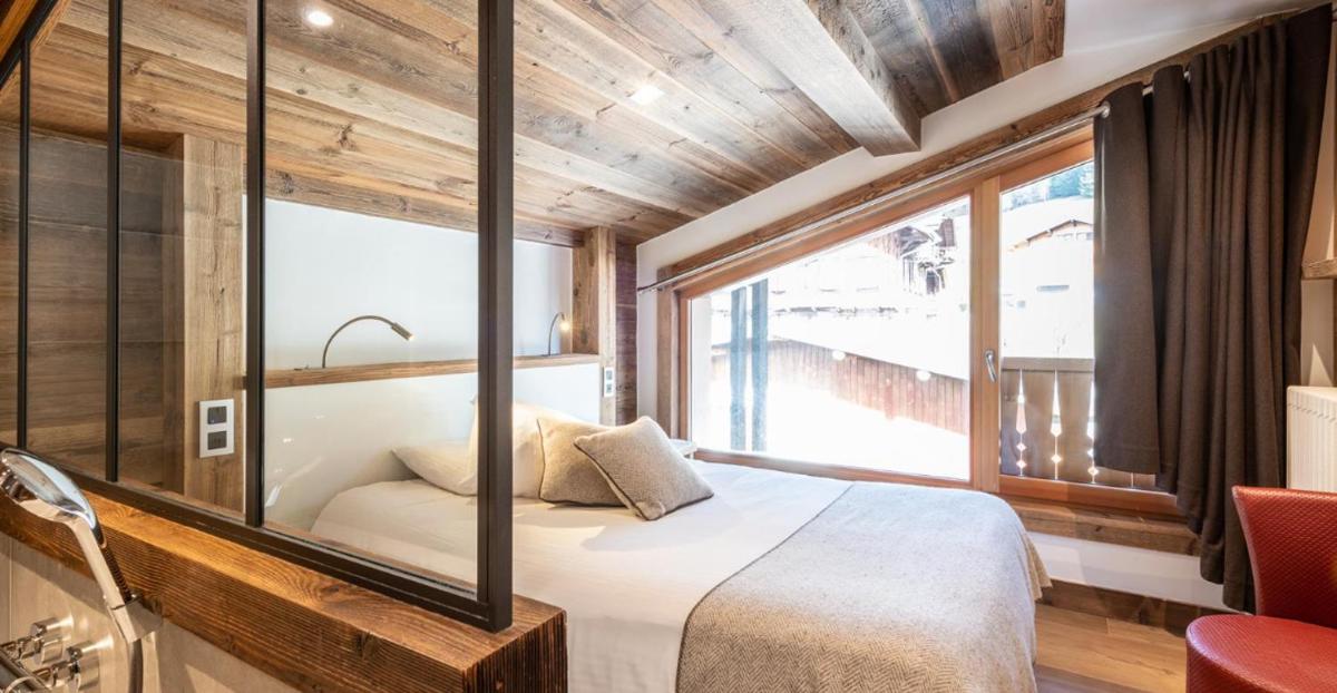 Un ou plusieurs lits dans un hébergement de l'établissement Hotel le Petit Dru