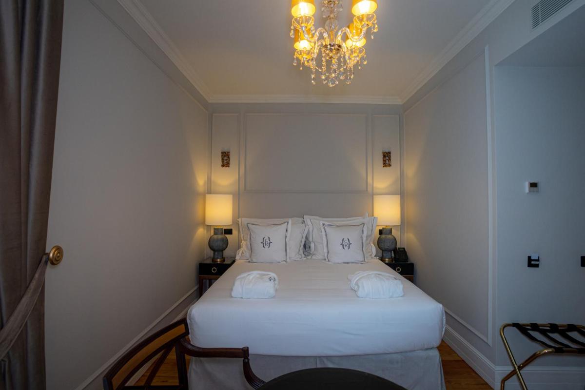 Uma cama ou camas num quarto em Solar do Requeijo by Luna Hotels & Resorts