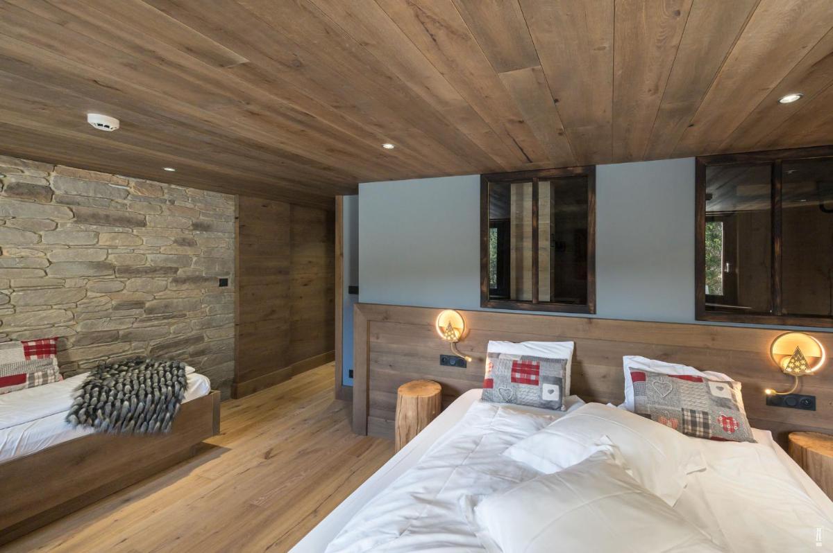 Un ou plusieurs lits dans un hébergement de l'établissement Chalet Hôtel & Spa Le Collet