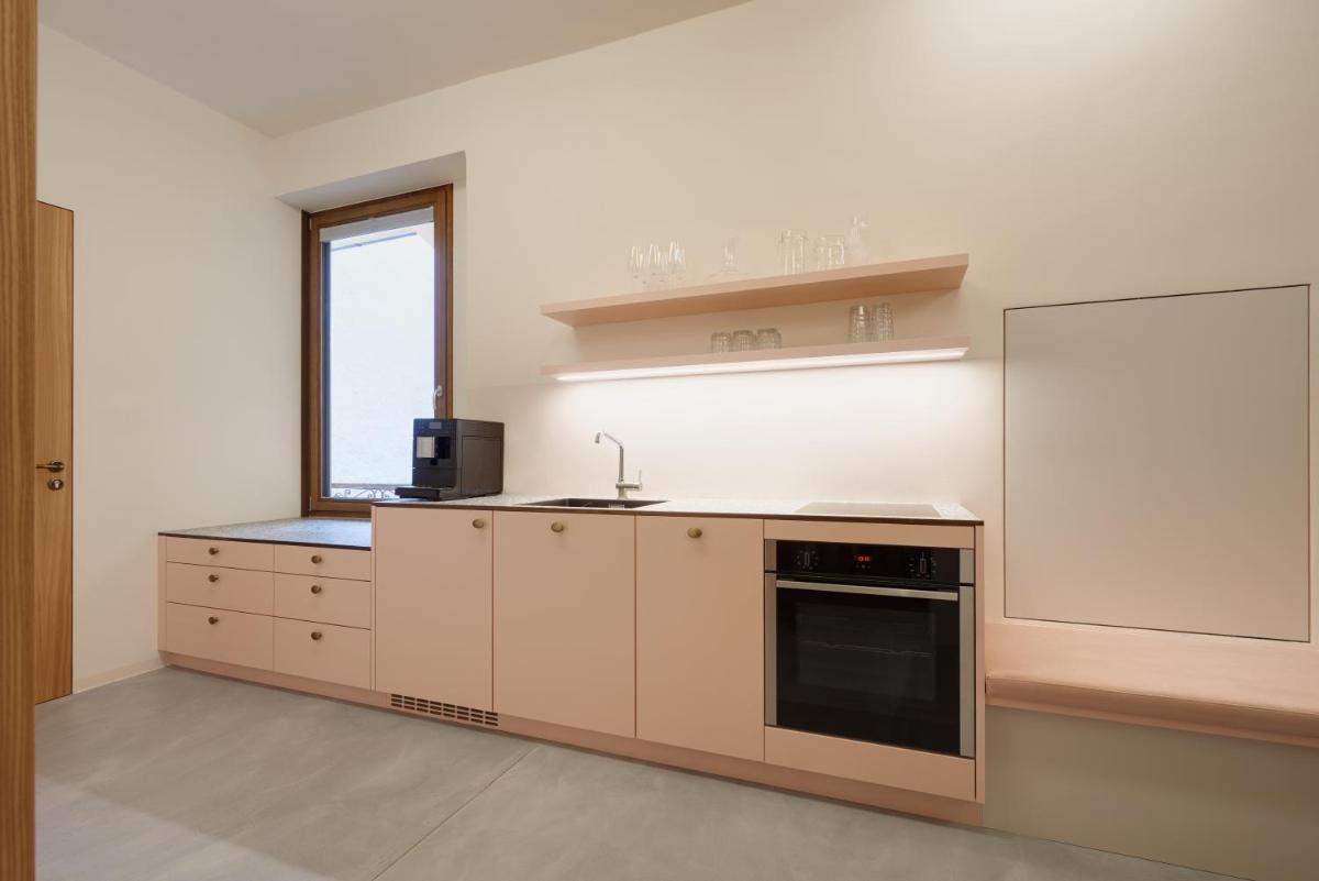 Goldengel Design-Suiten Frieda Maria im Herzen von Kaltern - Housity