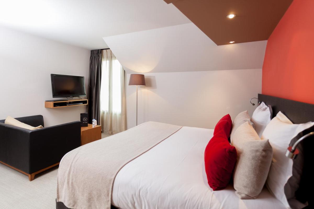 Un ou plusieurs lits dans un hébergement de l'établissement Hotel Restaurant Spa Ivan Vautier