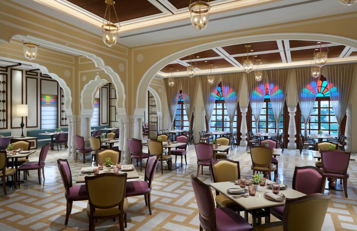 a rendering of a restaurant with tables and chairs at Hyatt Regency Jaipur Mansarovar in Jaipur a rendering of a restaurant with tables and chairs at Hyatt Regency Jaipur Mansarovar in Jaipur