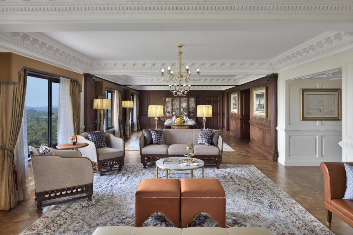 a living room with a couch and a table at Taj Mahal, New Delhi in New Delhi