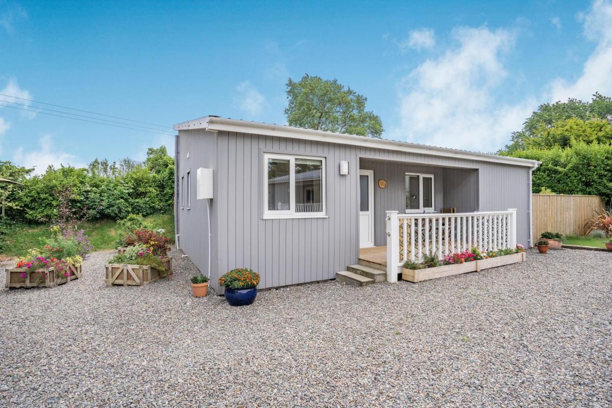 Caldey Lodge Bier Wood Lodges - Housity