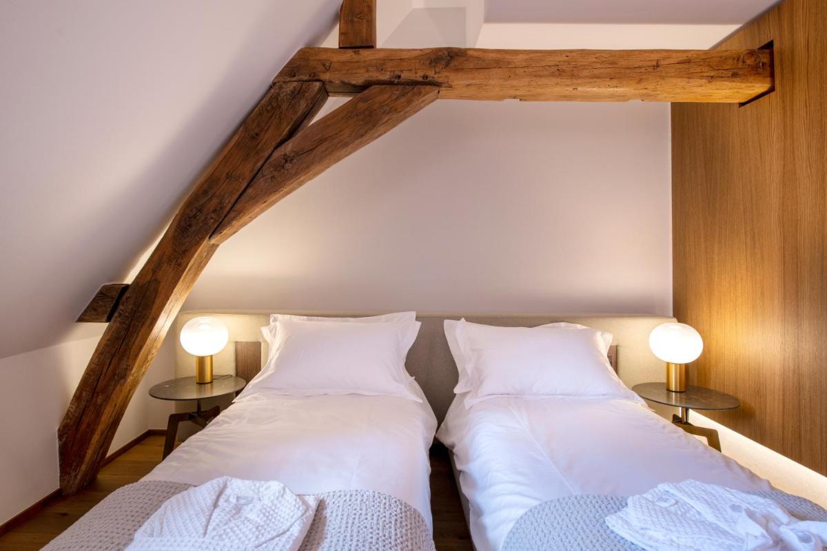 Un ou plusieurs lits dans un hébergement de l'établissement Chateau de Wallerand
