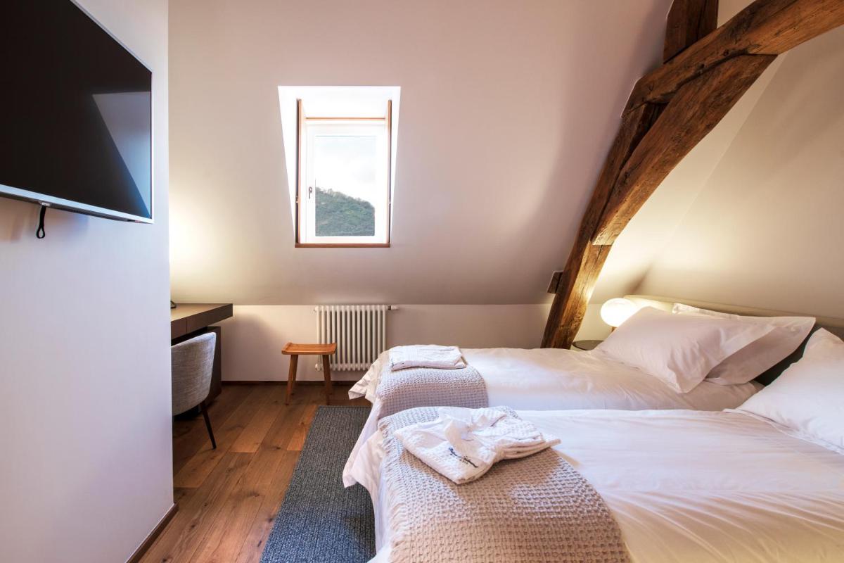 Un ou plusieurs lits dans un hébergement de l'établissement Chateau de Wallerand