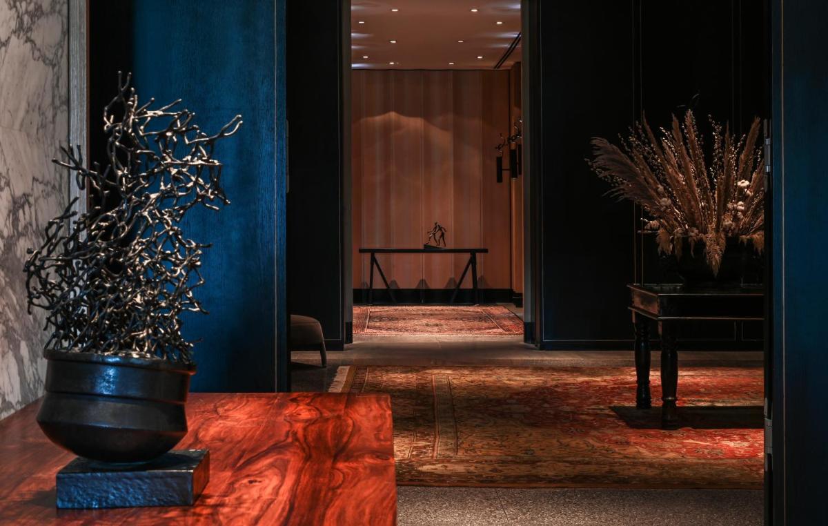 a hallway with a potted plant on a table at Grand Hyatt Gurgaon in Gurgaon