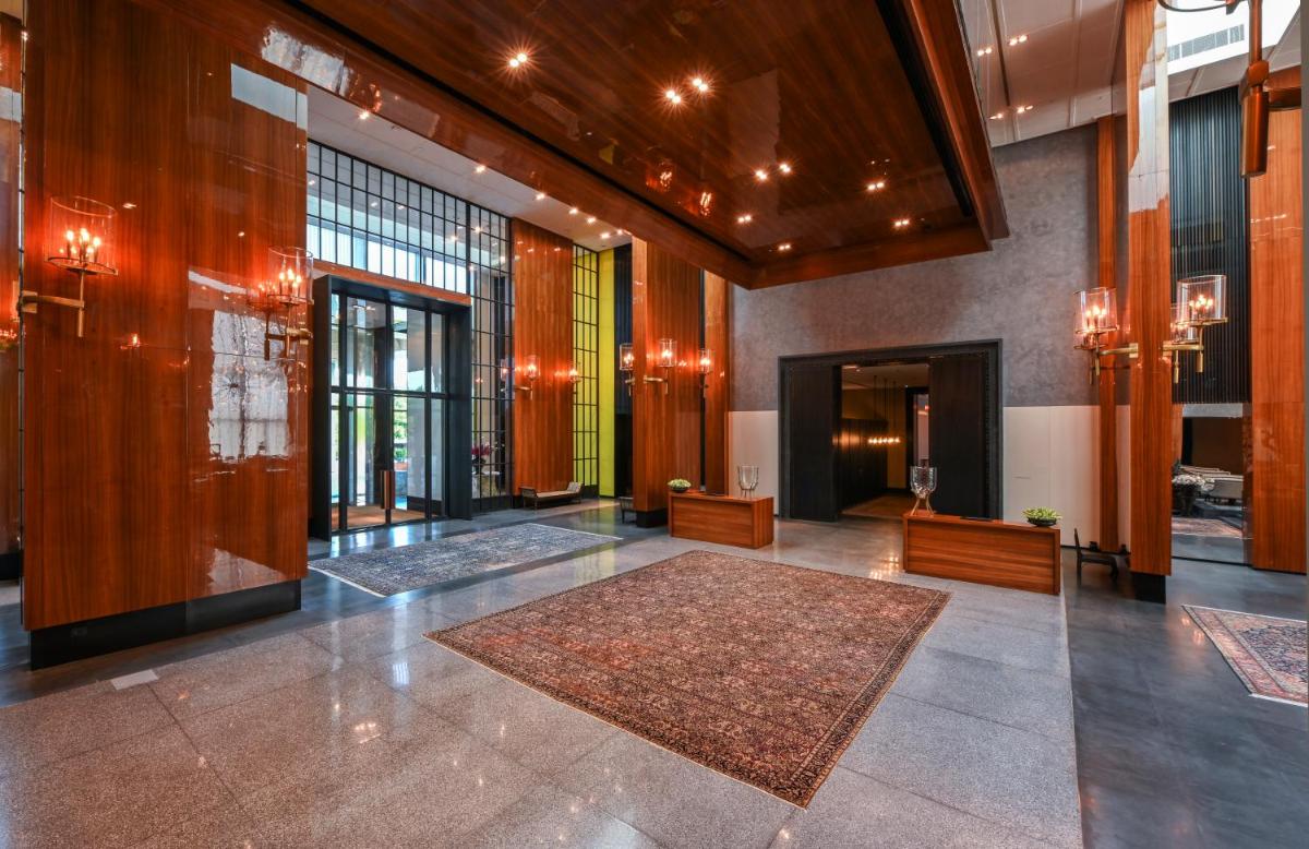 a lobby with a rug on the floor of a building at Grand Hyatt Gurgaon in Gurgaon