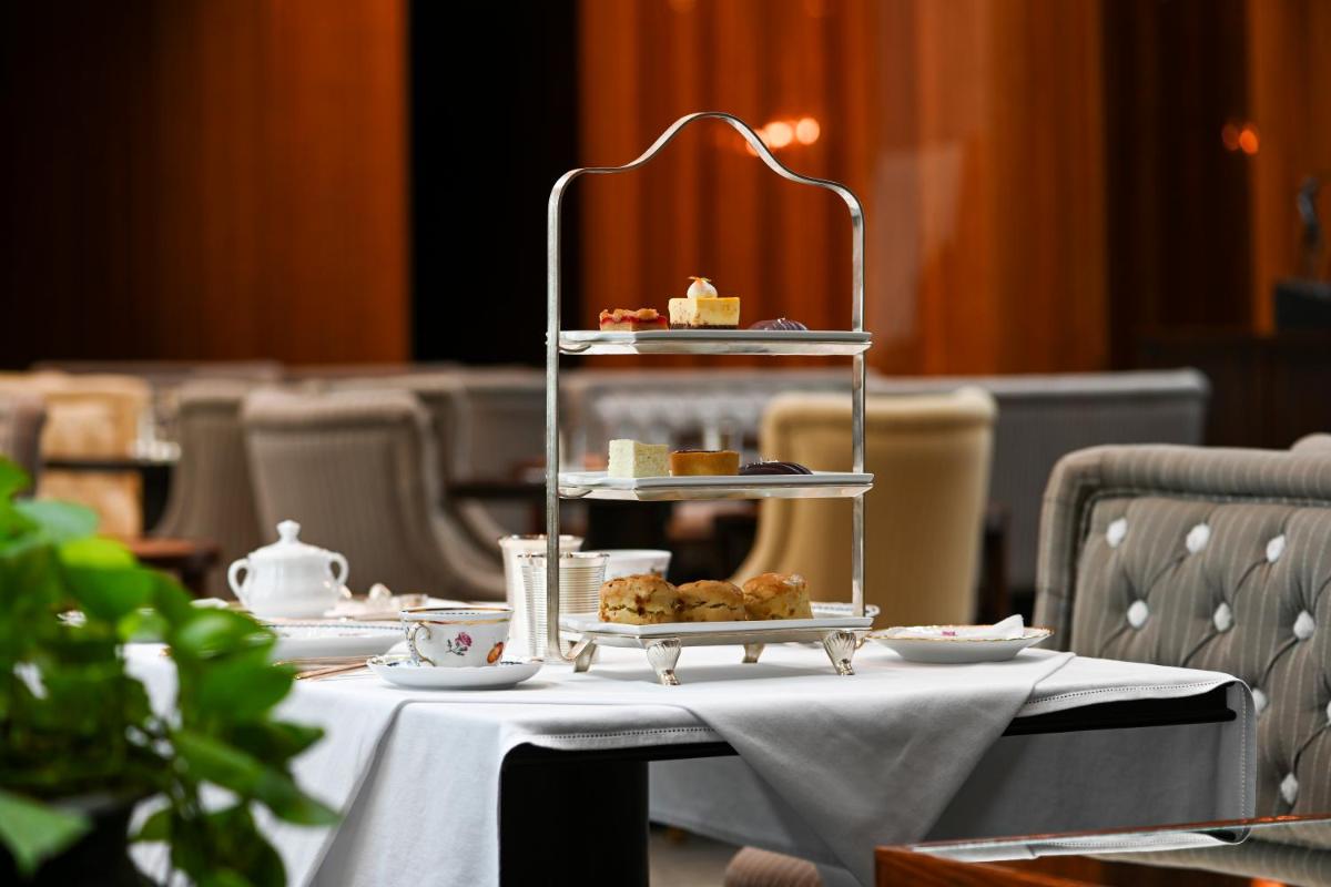 a table with a tray of pastries on it at Grand Hyatt Gurgaon in Gurgaon