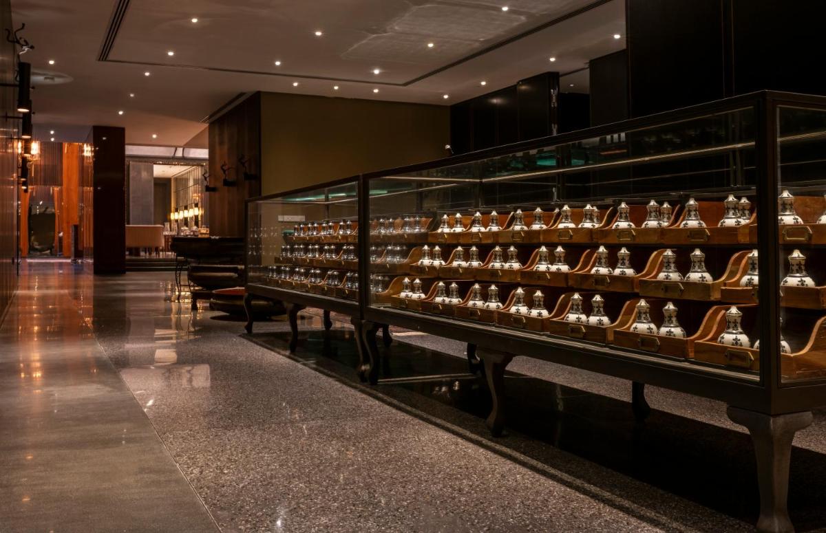 a display case in a store filled with lots of shoes at Grand Hyatt Gurgaon in Gurgaon