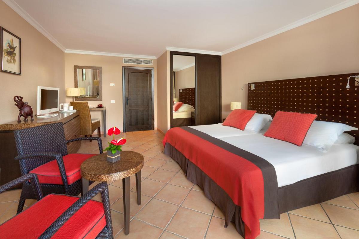 Cama o camas de una habitación en Seaside Sandy Beach