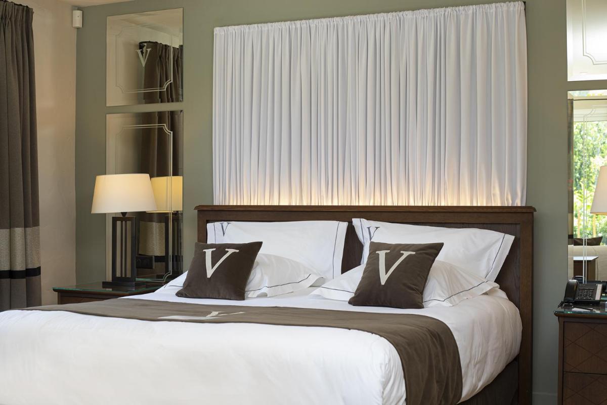Un ou plusieurs lits dans un hébergement de l'établissement Le Vallon de Valrugues Hotel Spa & Villas