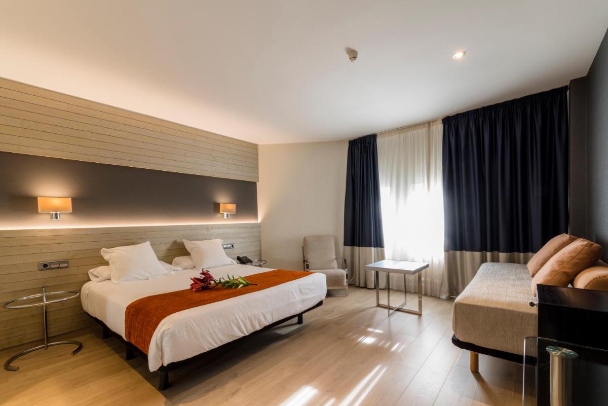 Cama o camas de una habitación en Hotel Avenida