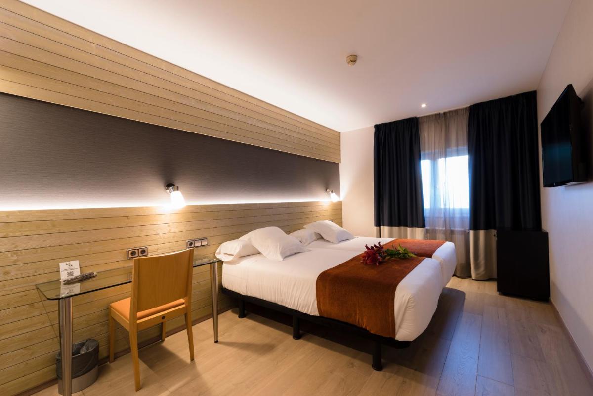 Cama o camas de una habitación en Hotel Avenida